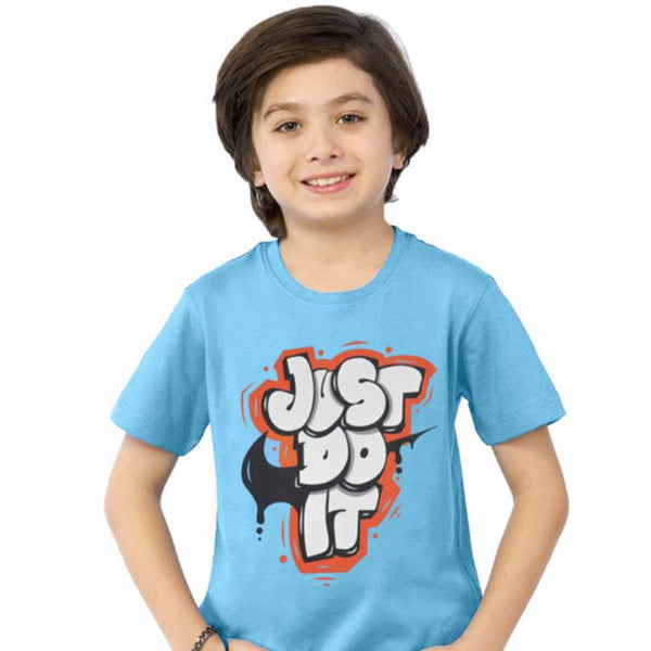 Child wearing a blue t-shirt with 'Just Do It' graphic design on a white background